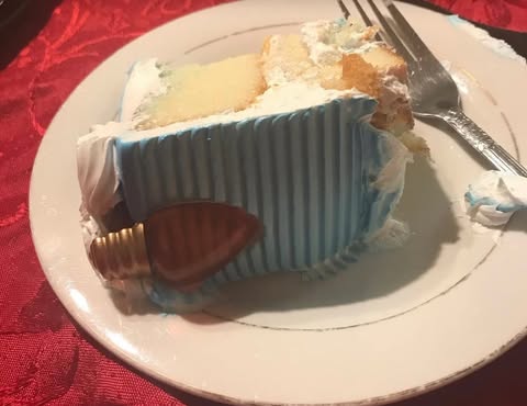 Picture of a slice of cake on a plate with a fork.